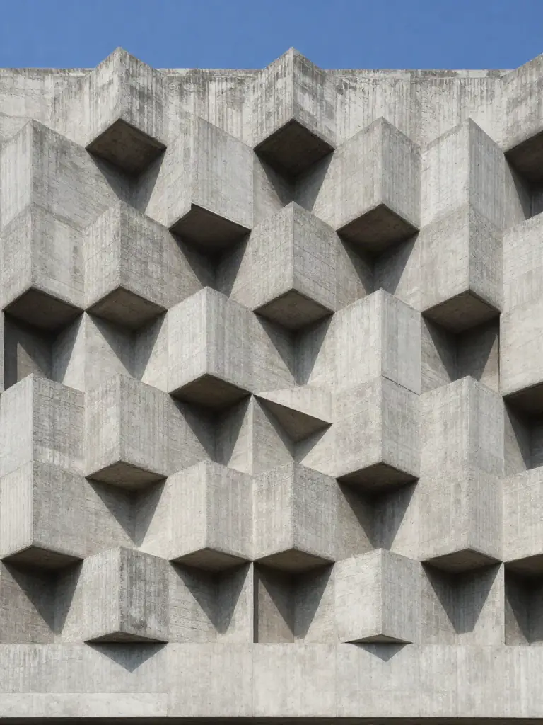 Repeating cast concrete facade in hard sunlight
